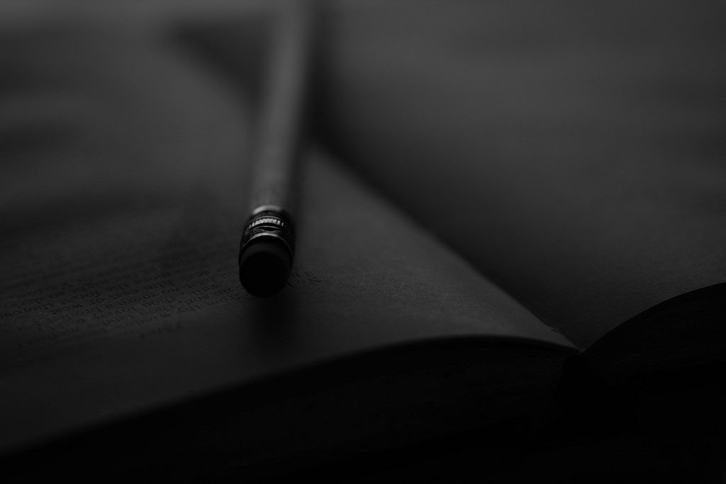 open journal with pencil