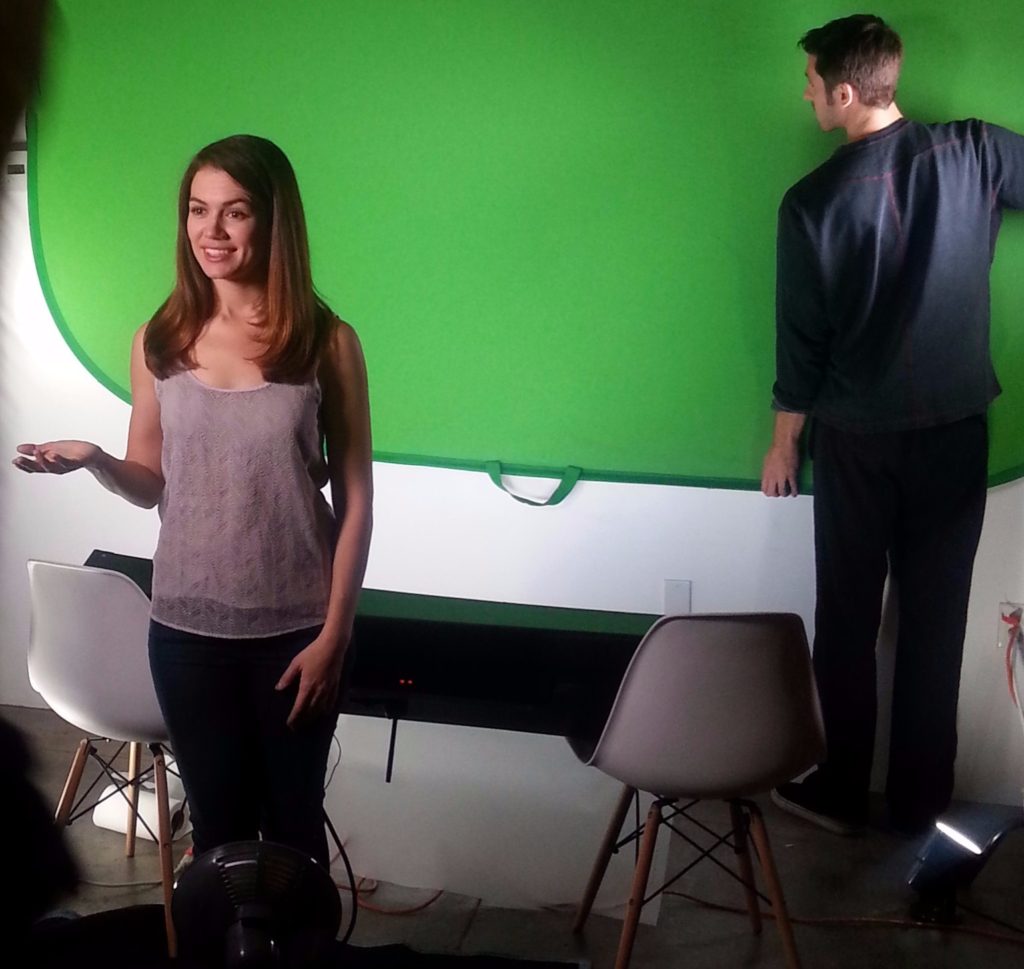 girl acting in front of green screen