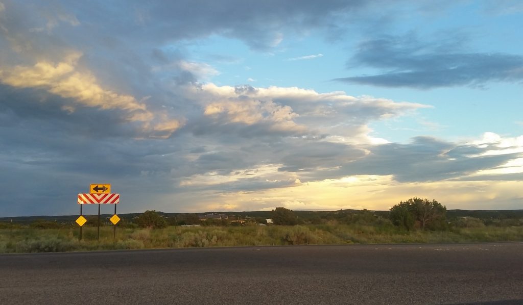 on the road in santa fe, sunset and road sign