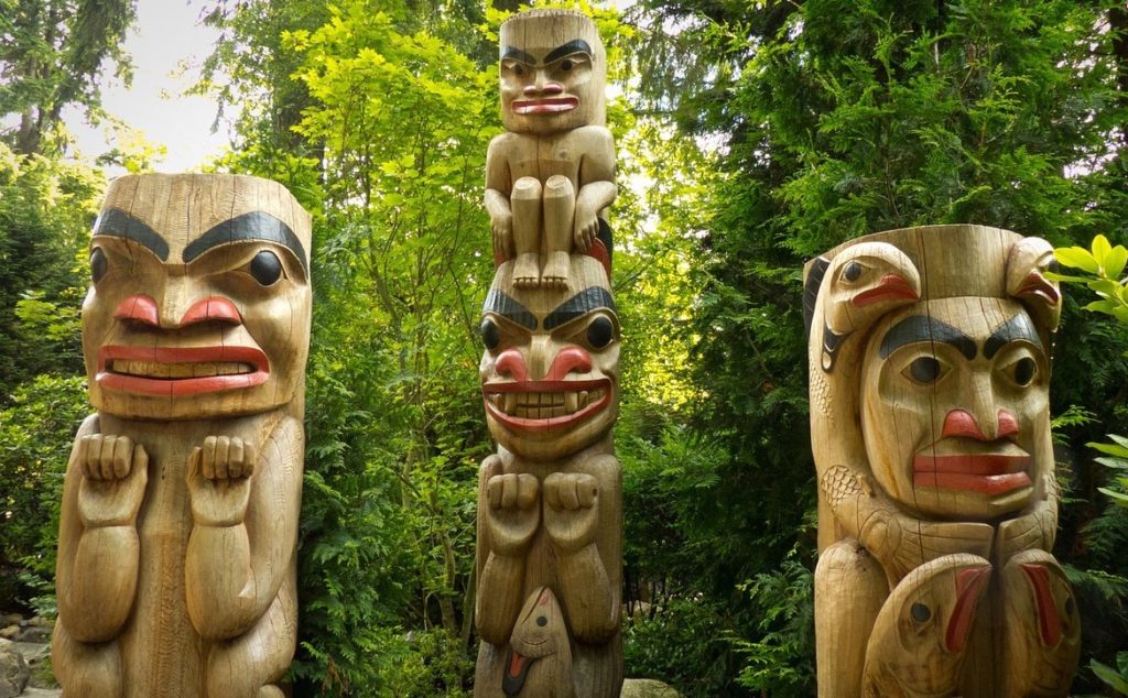 three native totem poles