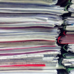 stacks of papers in folders